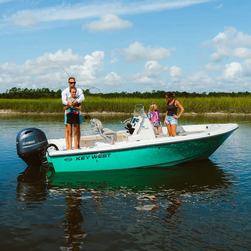 Family aboard a Key West boat in a South Carolina marsh